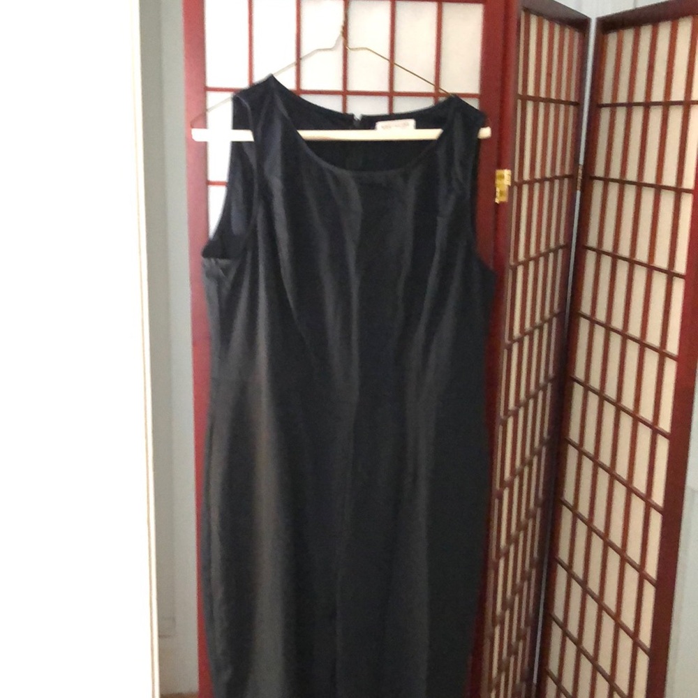 Brand new without tags, never worn. Navy fitted jumpsuit with boot cut bottom
